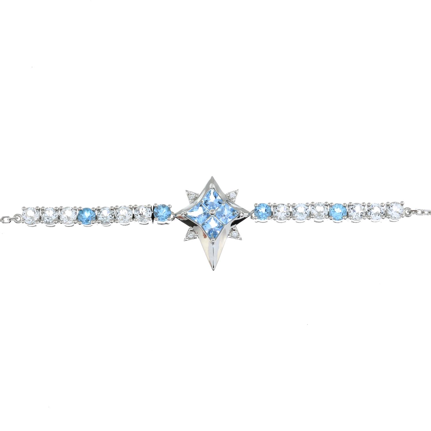 A blue topaz and gem-set bracelet.Stamped G14K.