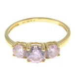 A 14ct gold pink cubic zirconia three-stone ring.Hallmarks for 14ct gold.
