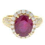 A glass-filled ruby and diamond cluster ring.Estimated total diamond weight 0.95ct.