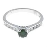 An 18ct gold green tourmaline and diamond ring.Green tourmaline weight 0.35ct.