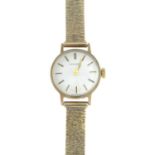 A lady's 9ct gold wristwatch, by Longines, with 9ct gold bracelet.Signed Longines.