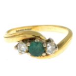 An 18ct gold emerald and diamond three-stone ring.