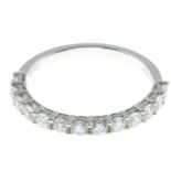 A brilliant-cut diamond half eternity ring.Total diamond weight 0.67ct,