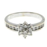 An 18ct gold brilliant-cut diamond cluster ring.Estimated total diamond weight 0.60ct,