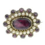 A late 19th century garnet and split pearl brooch.Length 2cms.