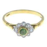 An 18ct gold emerald and diamond cluster ring.Emerald weight 0.20ct.