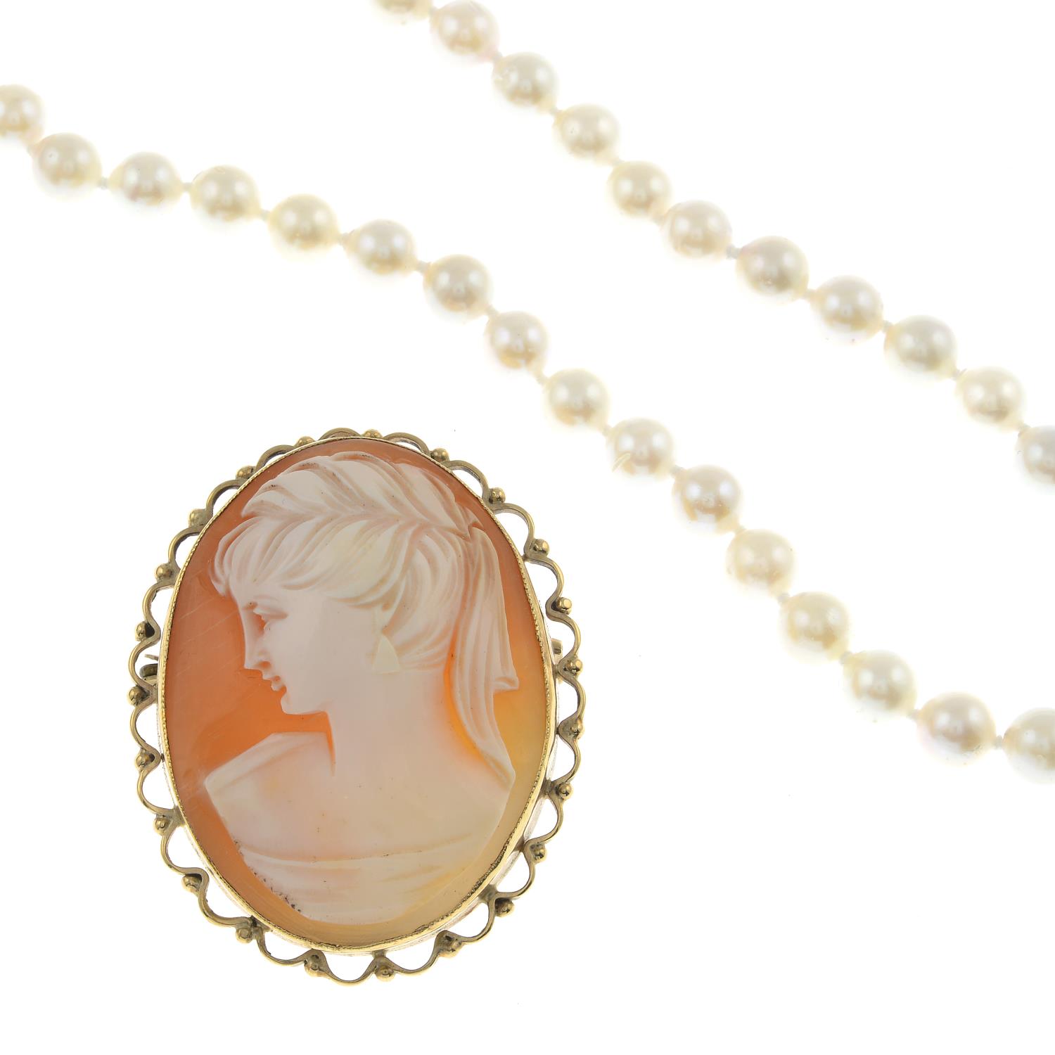 Shell cameo brooch, stamped 9CT, length 4.5cms, total weight 15.7gms.