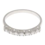 A platinum brilliant-cut diamond half eternity ring.Estimated total diamond weight 0.15ct.Hallmarks