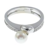 An 18ct gold cultured pearl and diamond dress ring.Estimated total diamond weight 0.25ct.