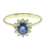An 18ct gold sapphire and diamond cluster ring.Estimated total diamond weight 0.20ct.