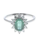 An emerald and diamond cluster ring.Emerald weight 0.80ct,