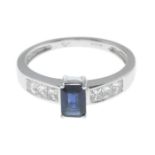 A 9ct gold sapphire and diamond ring.Estimated total diamond weight 0.40ct.