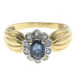 A sapphire and diamond cluster ring.Estimated total diamond weight 0.20ct.