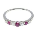 A ruby and brilliant-cut diamond half eternity ring.Total ruby weight 0.27ct,