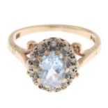 A 9ct gold aquamarine and diamond cluster ring.