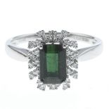 A green tourmaline and diamond cluster ring.Green tourmaline weight 1.31cts,