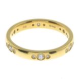 An 18ct gold brilliant-cut diamond band ring.Total diamond weight 0.24ct,