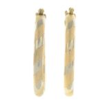 A pair of 9ct gold textured hoop earrings.Hallmarks for London.Length 2.5cms.