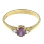 An 18ct gold ruby and diamond three-stone ring.Ruby weight 0.38ct.