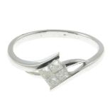 An 18ct gold square-shape diamond cluster ring.Total diamond weight 0.25ct,