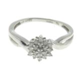 An 18ct gold single-cut diamond cluster ring.Total diamond weight 0.25ct,