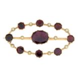 A late 19th century gold garnet and split pearl brooch.