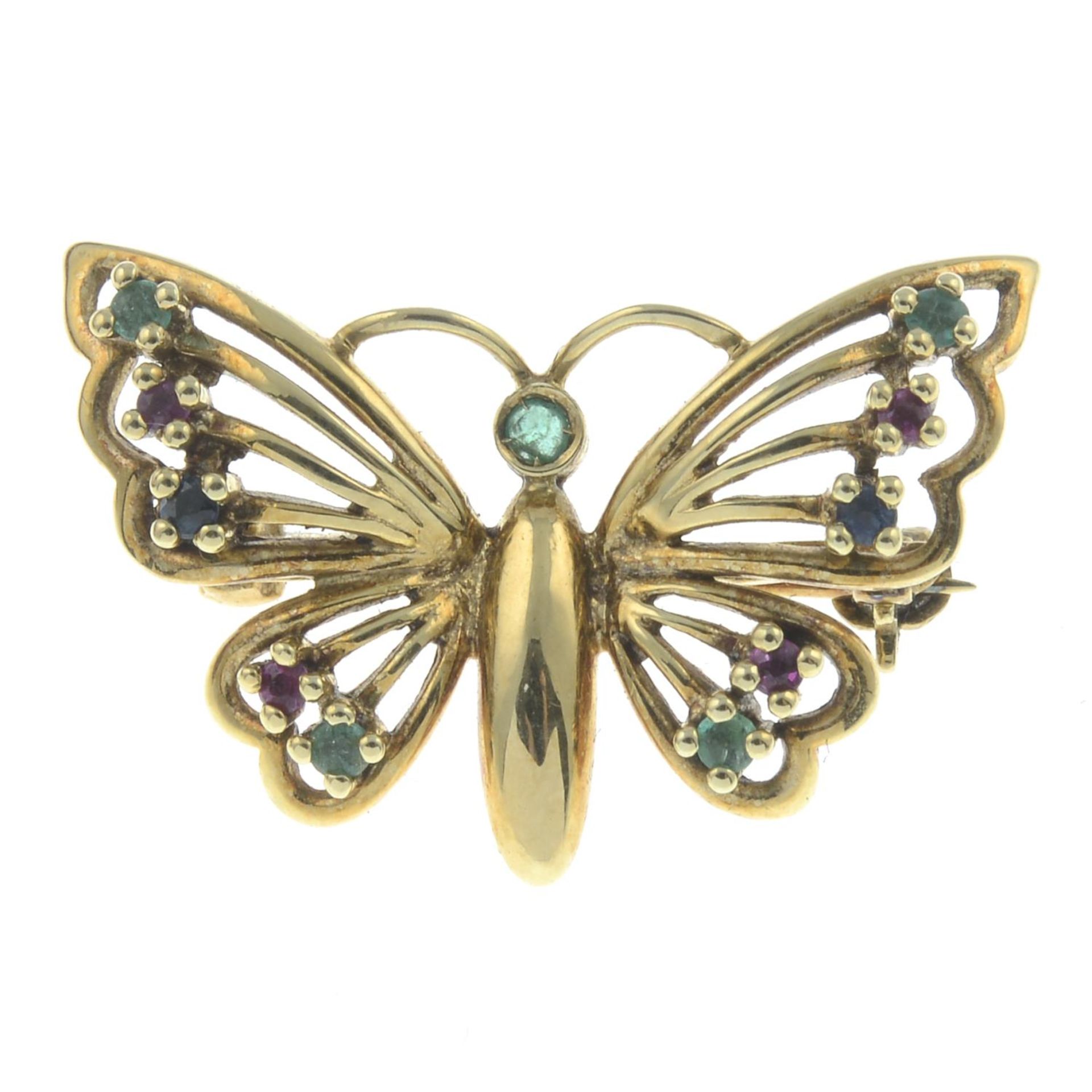 An openwork butterfly brooch, with emerald, ruby and sapphire highlights.Stamped 585.