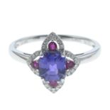 A sapphire, ruby and diamond dress ring.Sapphire weight 1.50cts,