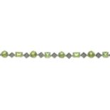 A peridot and diamond bracelet.Estimated total diamond weight 0.70ct.