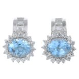 A pair of blue topaz and cubic zirconia earrings.Stamped 750.