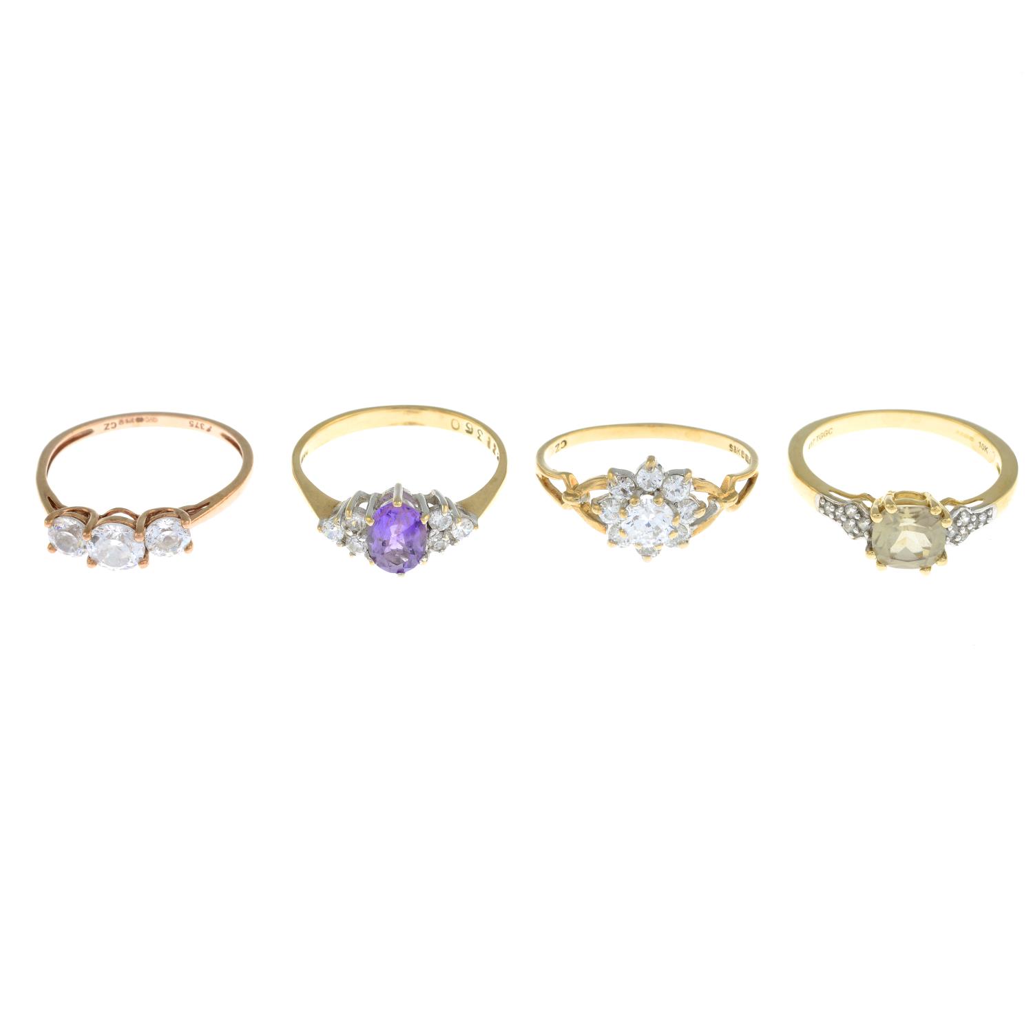 Four 9ct gold gem-set rings, to include a cubic zirconia cluster ring.
