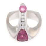 A pink tourmaline and diamond abstract ring.Estimated total diamond weight 0.10ct.Stamped 14K.Ring