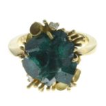 An 18ct gold synthetic emerald free-form crystal dress ring, with diamond accent surround.