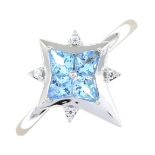 A blue topaz and white gem dress ring.Stamped G14K.