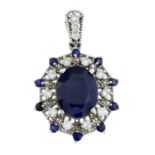 A sapphire and diamond cluster pendant.Estimated total diamond weight 0.40ct.Stamped 14K.