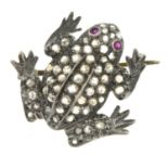 A rose-cut diamond and ruby frog brooch.One diamond deficient.Length 2.6cms.