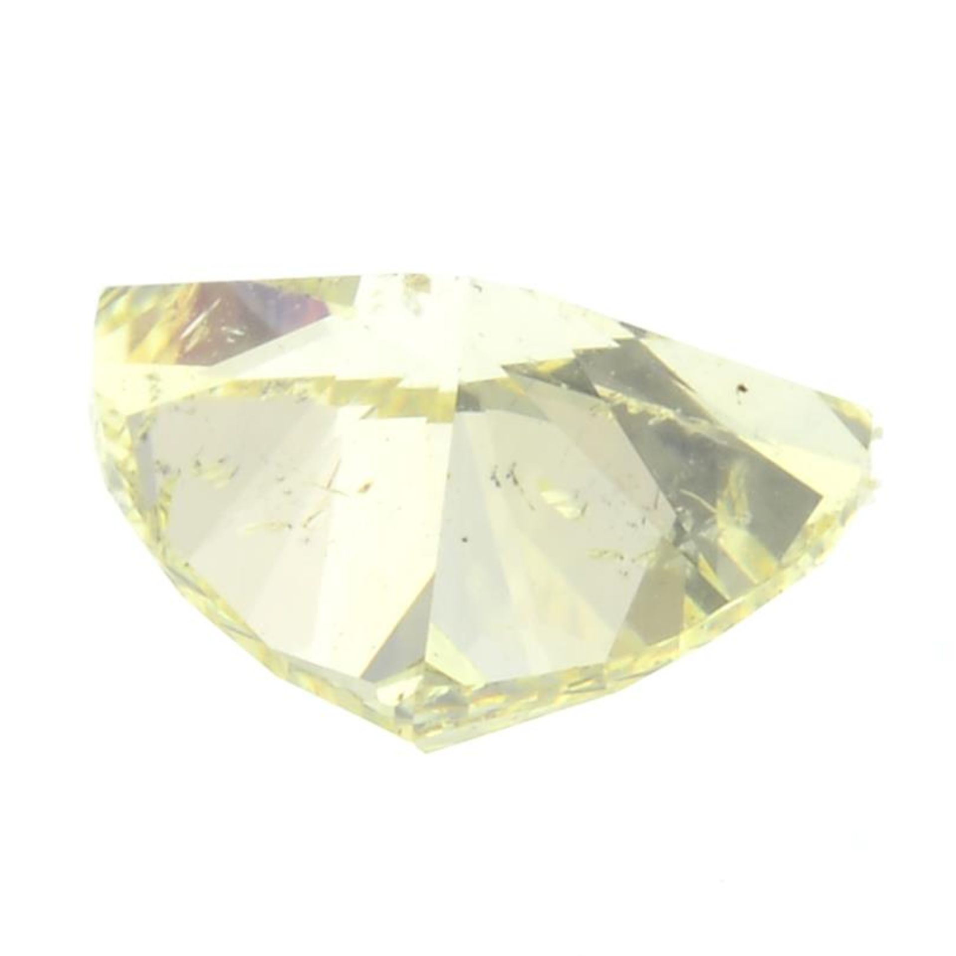 A triangular-shape natural Fancy Yellow diamond. - Bild 2 aus 3