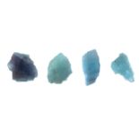 Nine light blue tourmaline crystals.