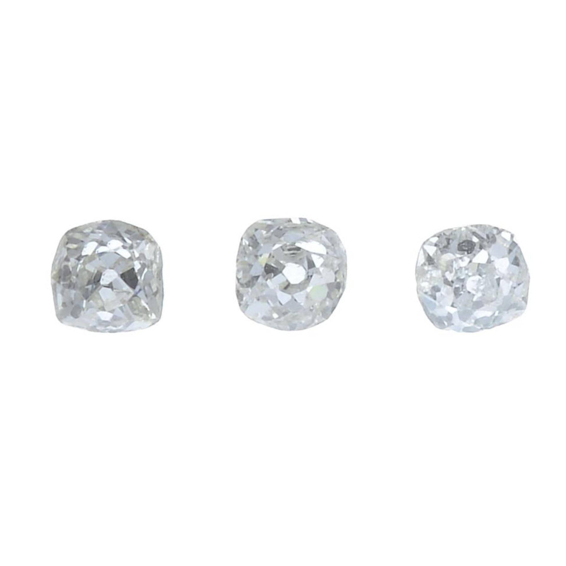 Three old-cut diamonds.
