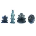 Nine sapphire and chrysoberyl carvings.