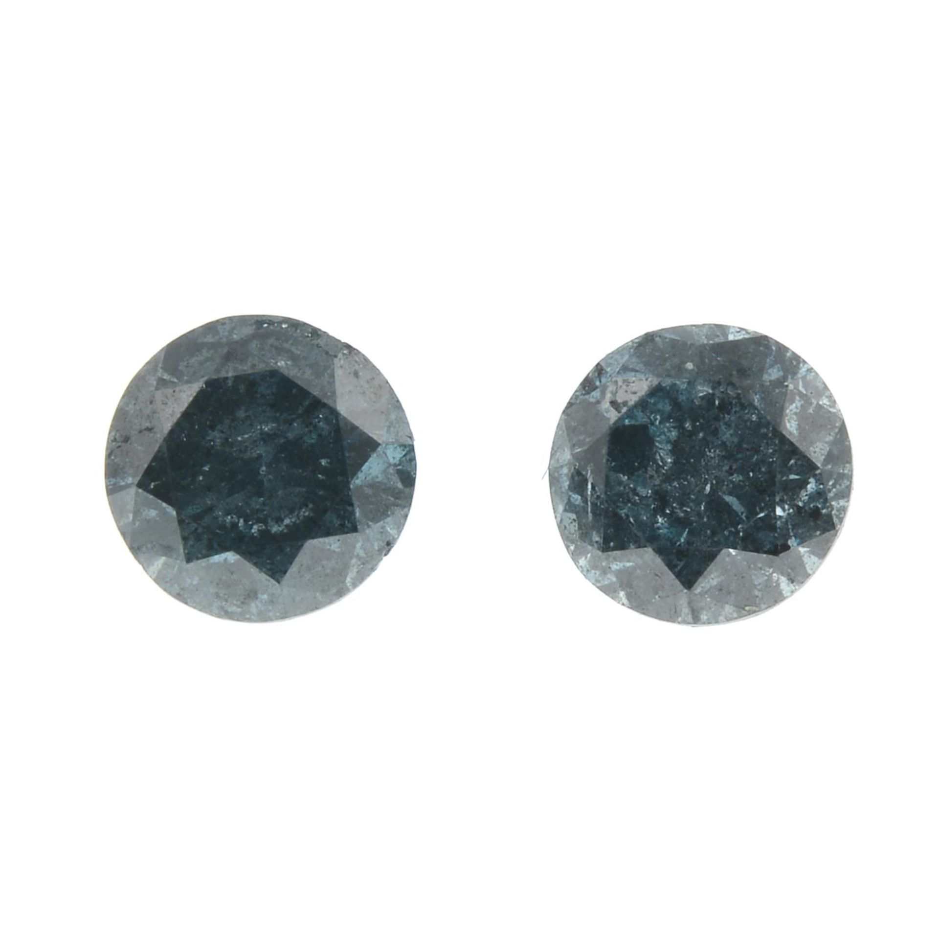 Two brilliant-cut 'blue' diamonds.