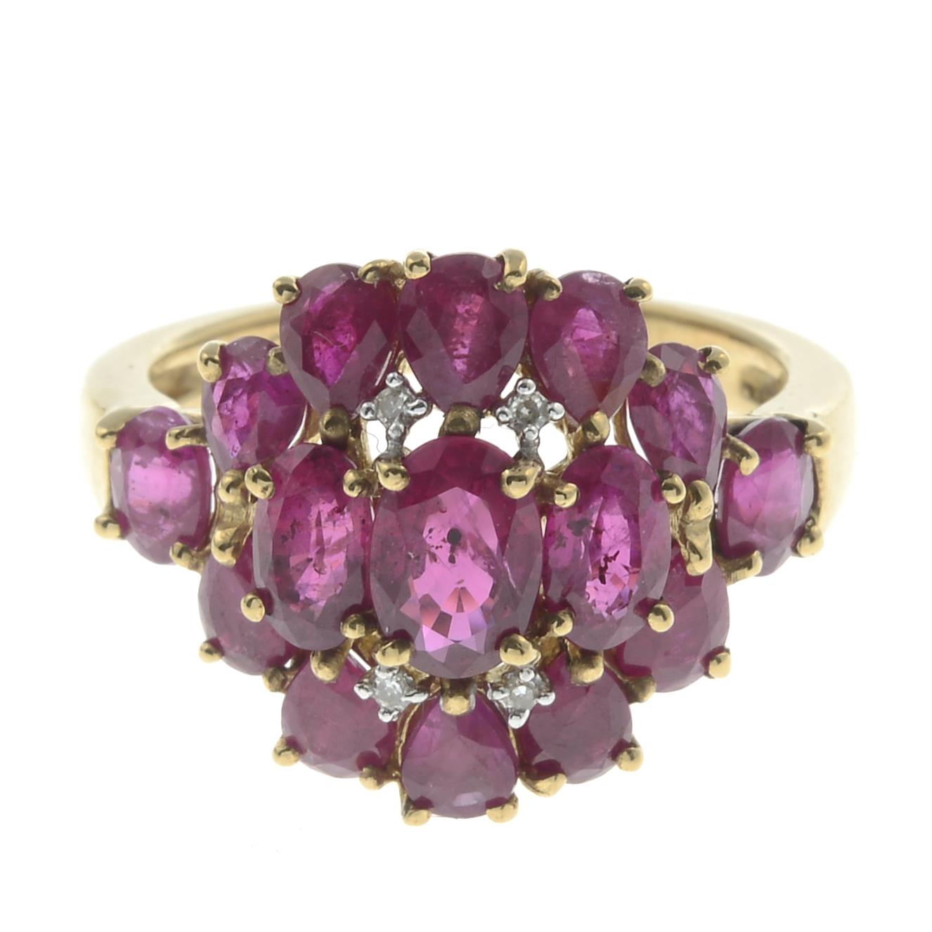 A 9ct gold glass-filled ruby and diamond dress ring.Hallmarks for Birmingham.Ring size J.