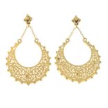 A pair of drop earrings.