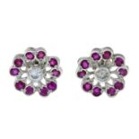 A pair of platinum diamond and ruby floral cluster earrings.Estimated total diamond weight 0.30ct,