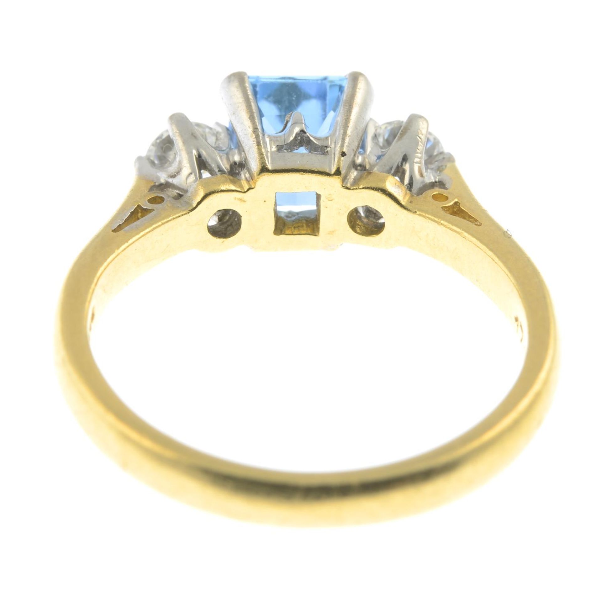 An 18ct gold aquamarine and diamond three-stone ring.Estimated total diamond weight 0.30ct, - Image 2 of 2