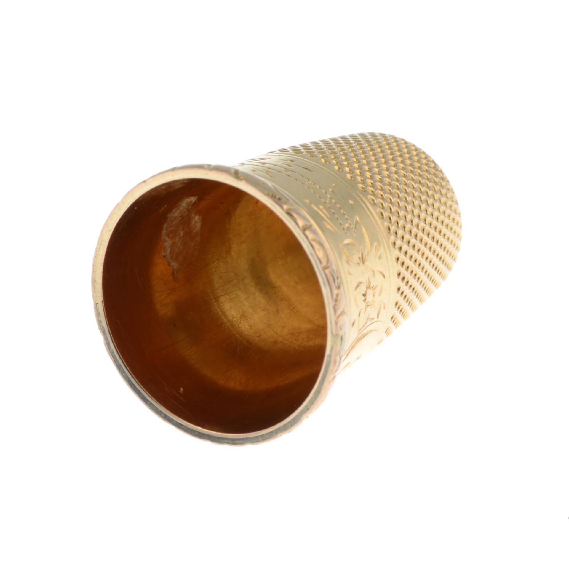 An early 20th century gold thimble.Length 2.3cms. - Image 3 of 3