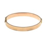 An early 20th century 9ct gold hinged bangle.Hallmarks for Chester, 1913.Inner diameter 6.1cms.