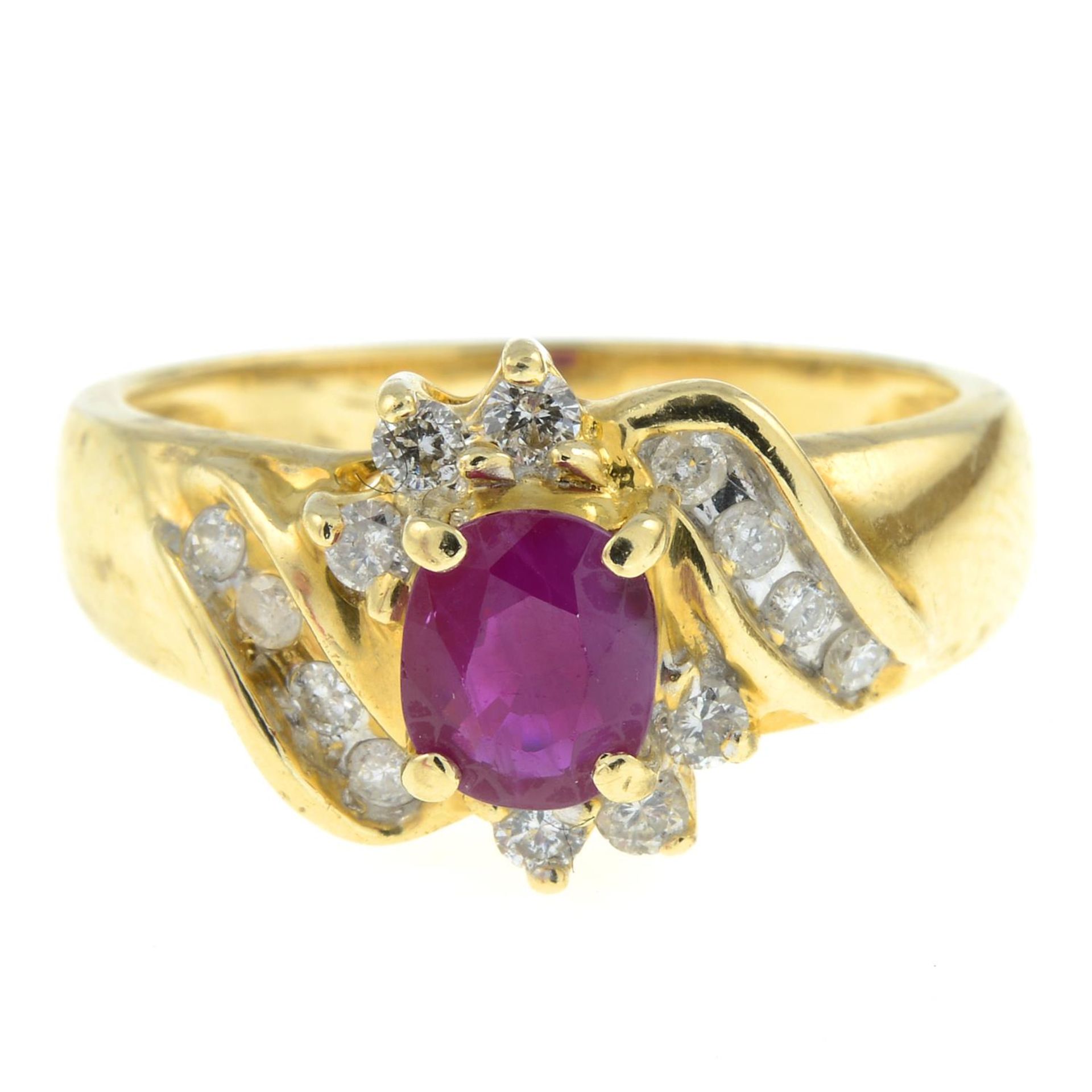 A diamond and ruby cluster ring.Estimated total diamond weight 0.20ct.