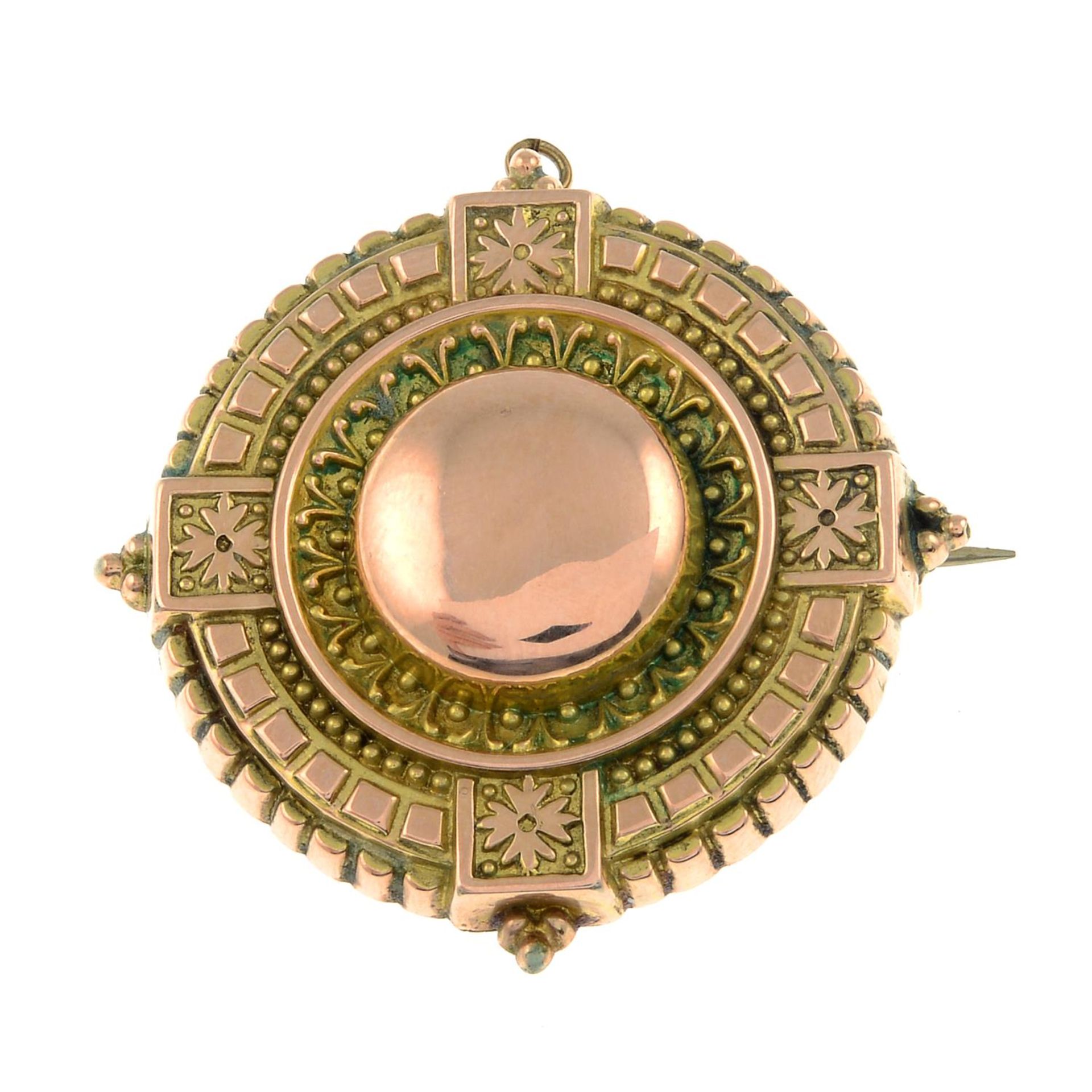 A late 19th century gold target brooch.Length 3.6cms.