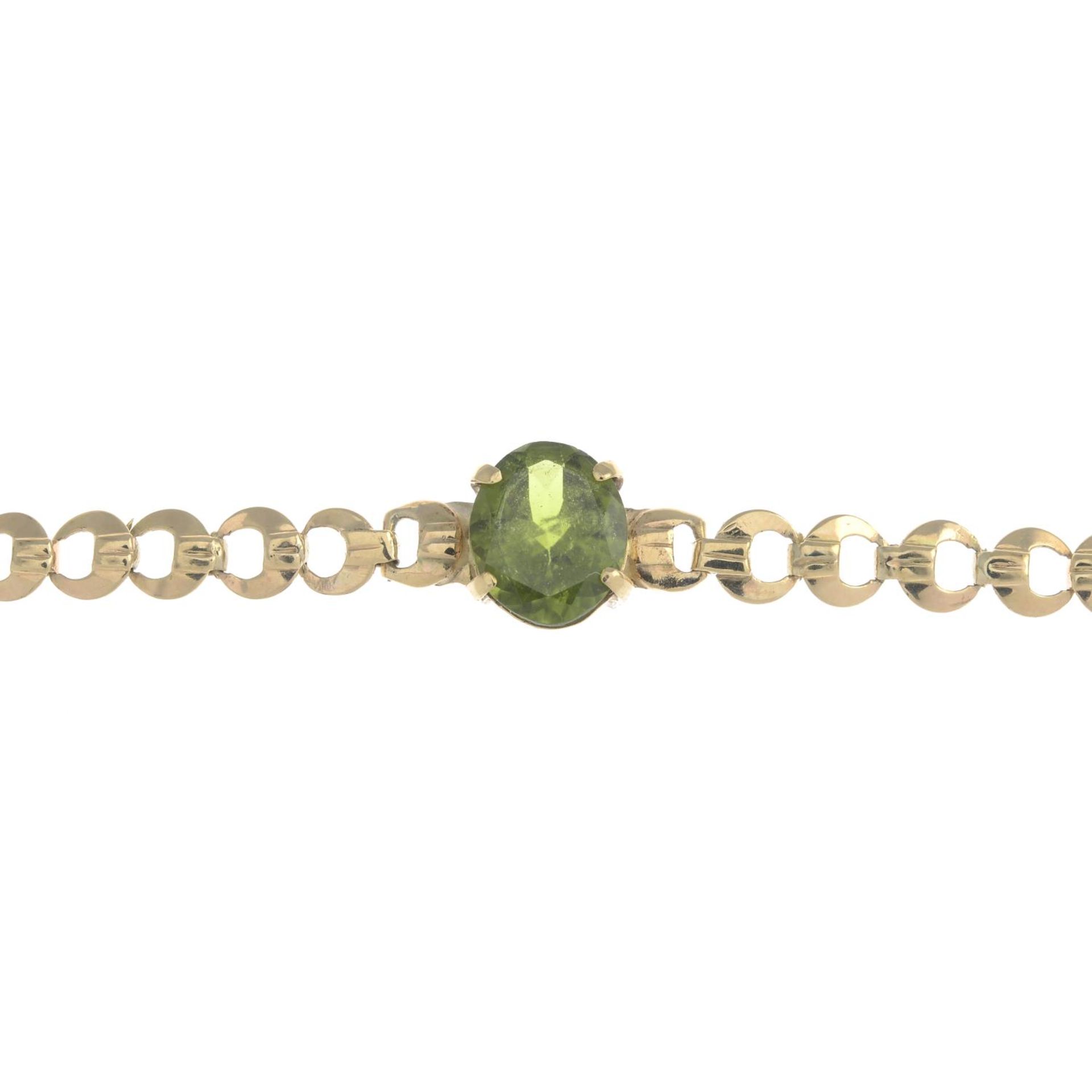 A 9ct gold peridot bracelet.Hallmarks for Birmingham, 1963.Length 16.5cms.